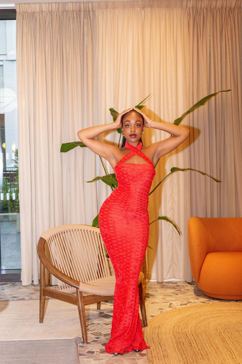 The Esther Royale Gown in red &mdash; hands raised